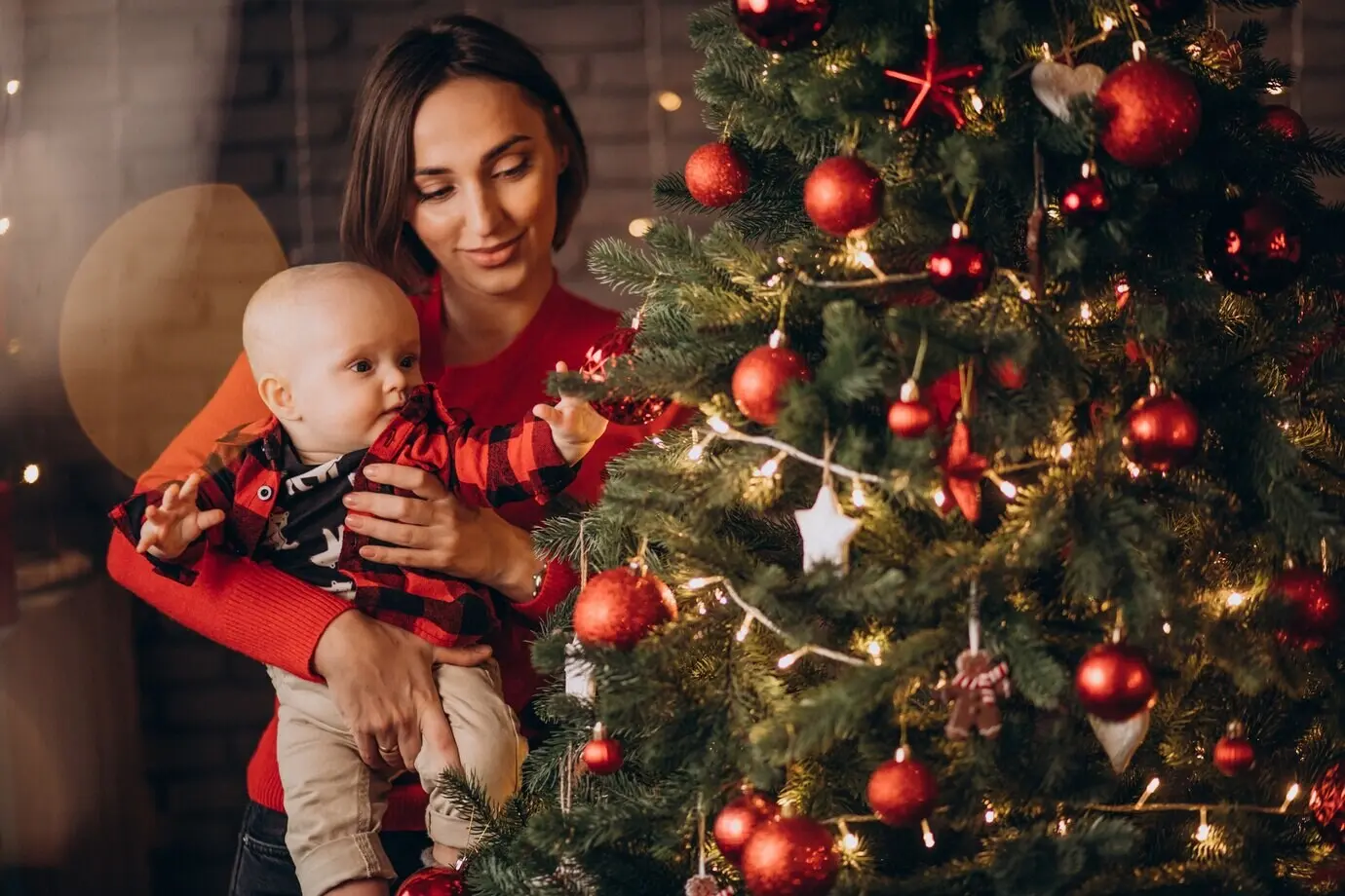 A mother and her baby boy celebrate Christmas.
