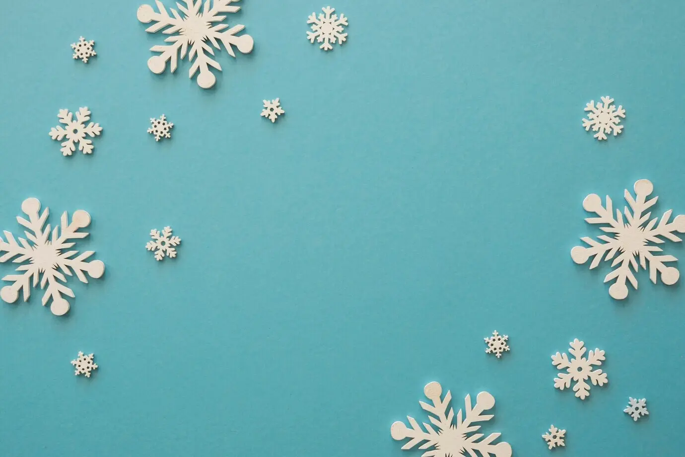 Top-down view of minimalist white snowflakes